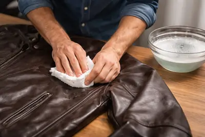 Close-up showing stain removal process on small jacket area